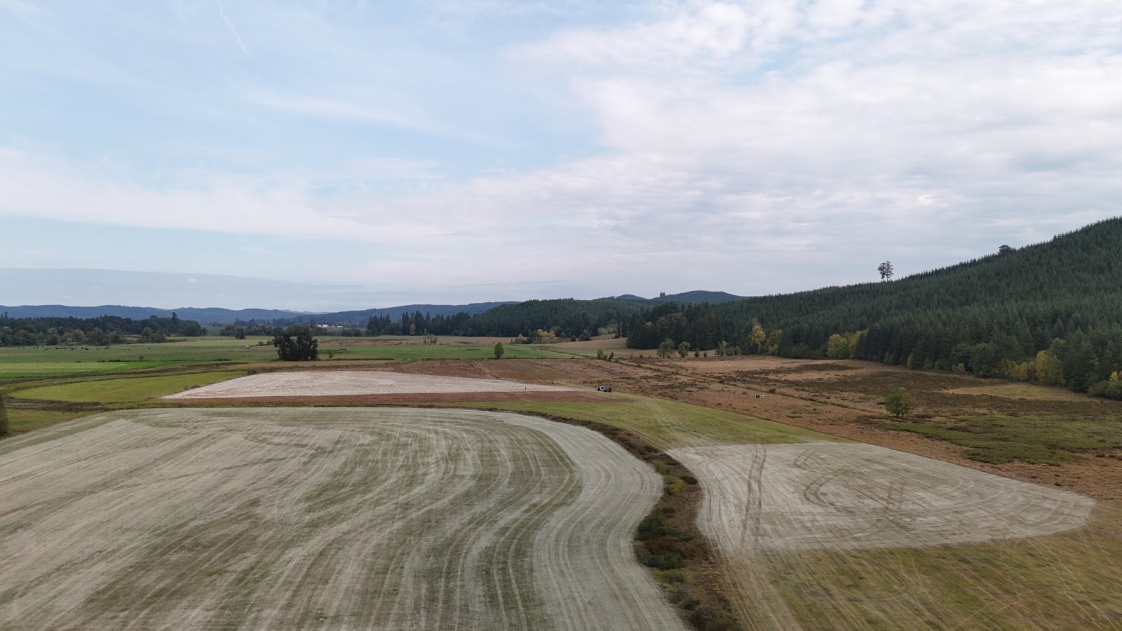 Aerial view of farm fields spread with rock dust